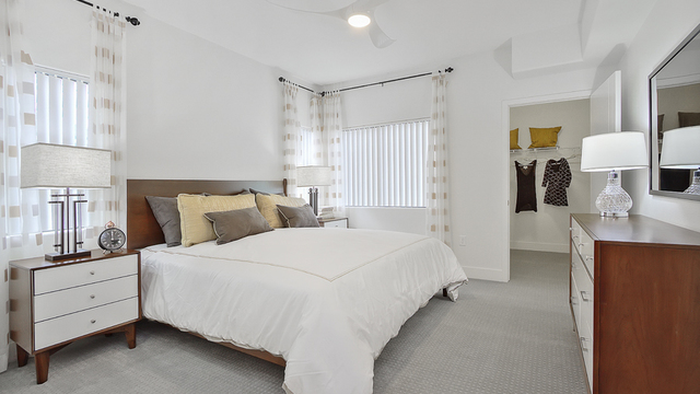 Evolve Apartments - Bedroom with White Furnishings in View