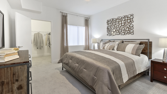 Evolve Apartments - Interior of Bedroom with Grey Furnishing