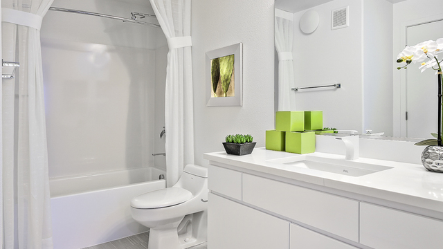 Evolve Apartments - Bathroom with Toilet, Sleek Fixtures, and Furnishing